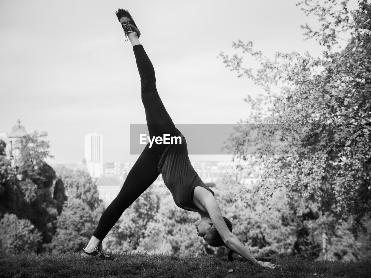 Full length of woman practicing yoga in park