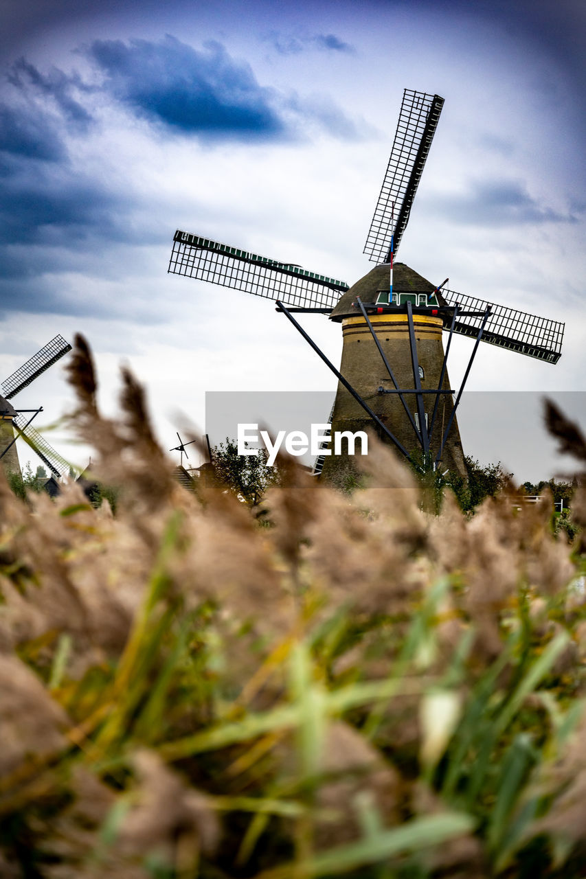 renewable energy, windmill, alternative energy, environmental conservation, wind power, mill, wind turbine, turbine, power generation, environment, sky, traditional windmill, nature, rural scene, landscape, cloud, agriculture, plant, building, no people, field, technology, wind, day, architecture, land, grass, outdoors, low angle view, farm, rural area