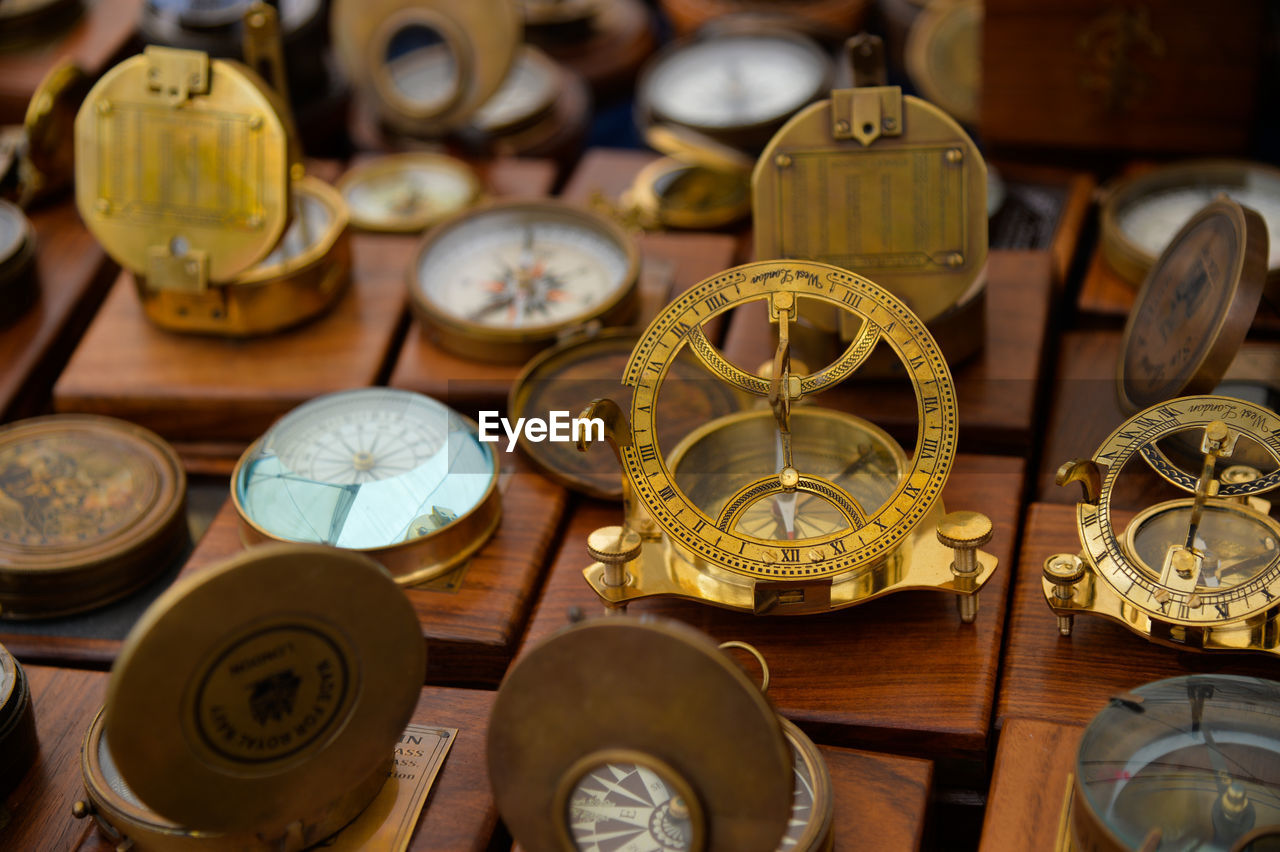 High angle view of navigational compasses for sale