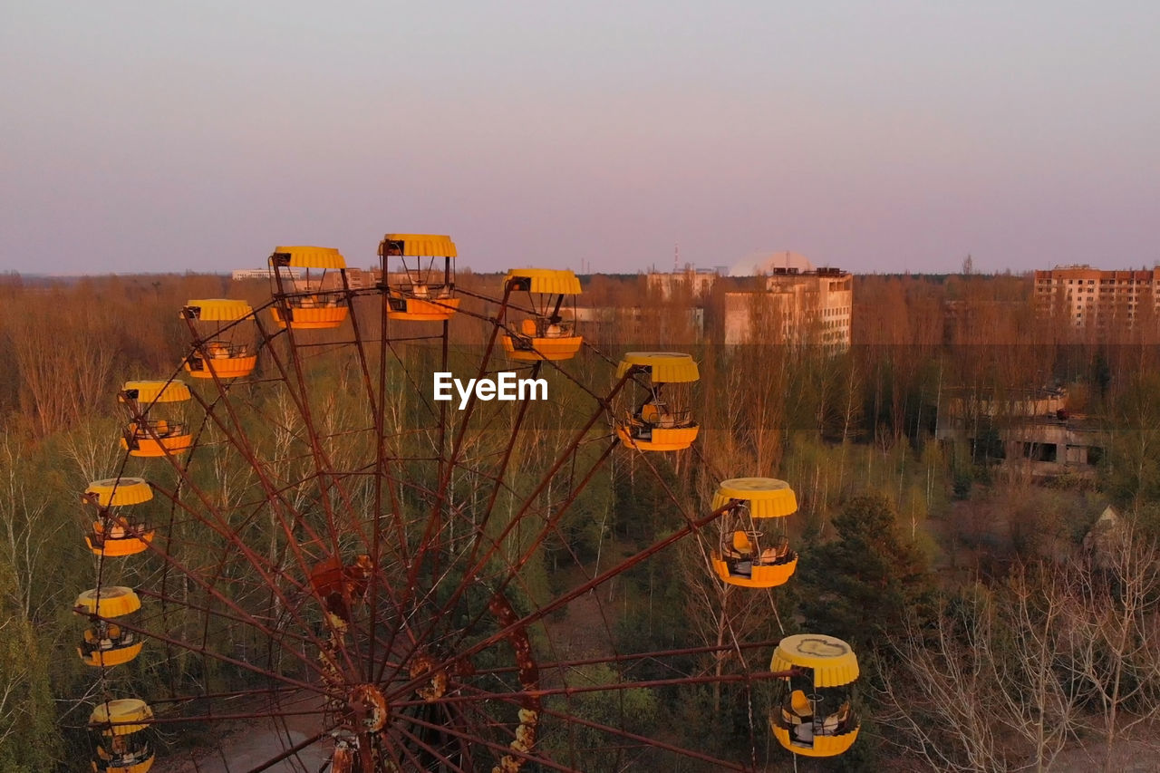 Ferris wheel in the city of pripyat at sunset time. apocalyptic city of pripyat 