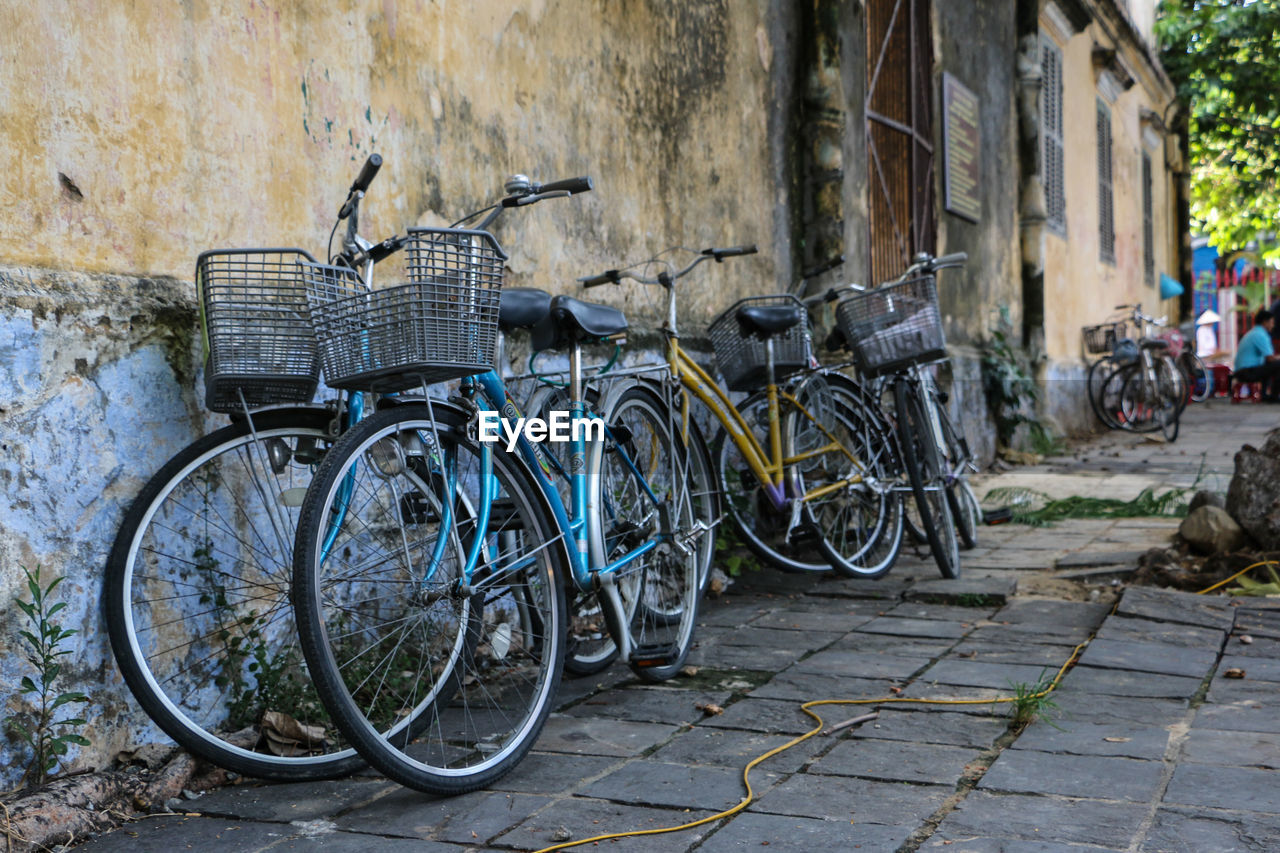 Bicycles parked on footpath outside building