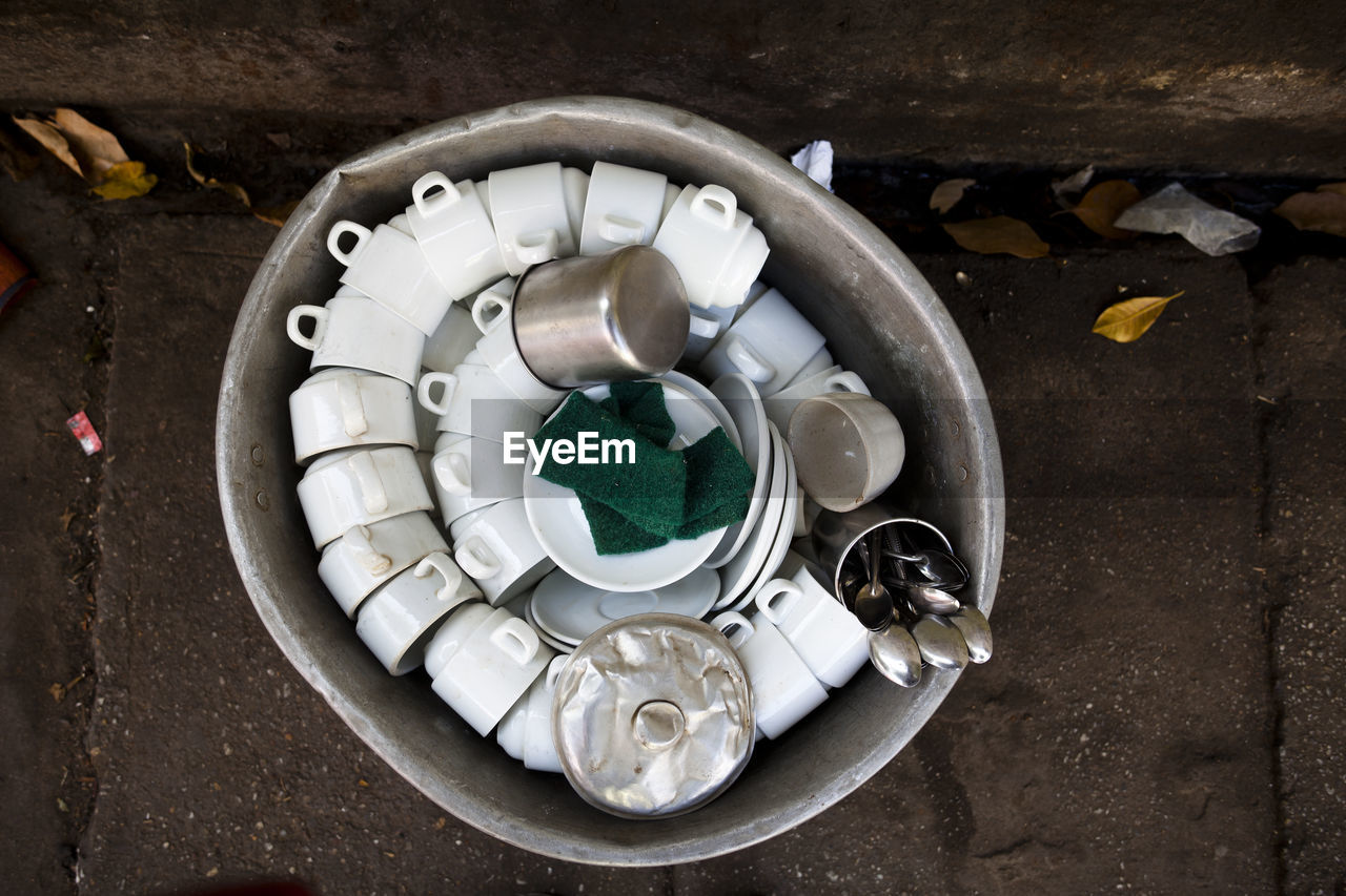 High angle view of cups in container