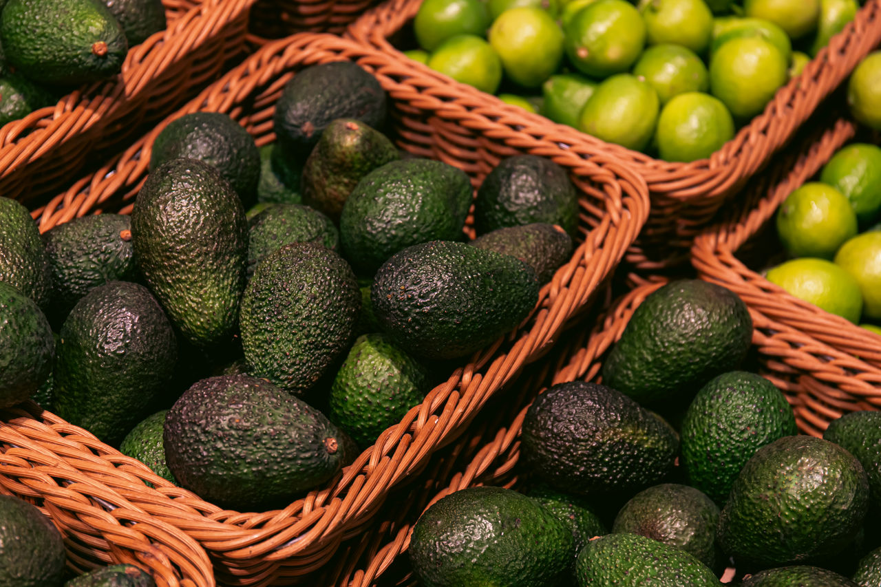 Baskets with avocado in a supermarket close up.