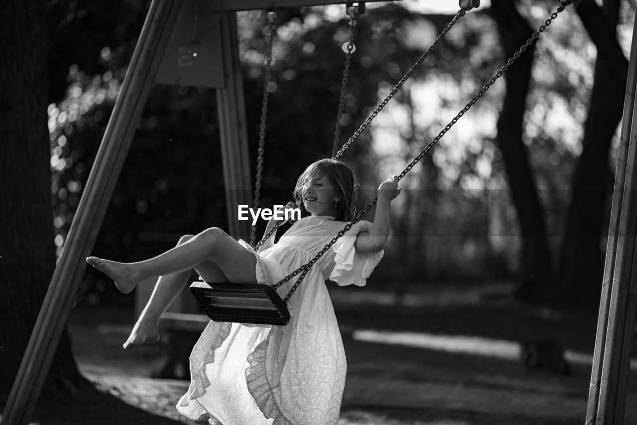 Girl swinging at playground