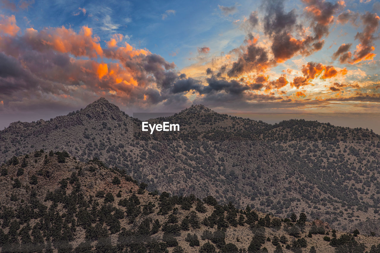 Scenic view of mountains against sky during sunset
