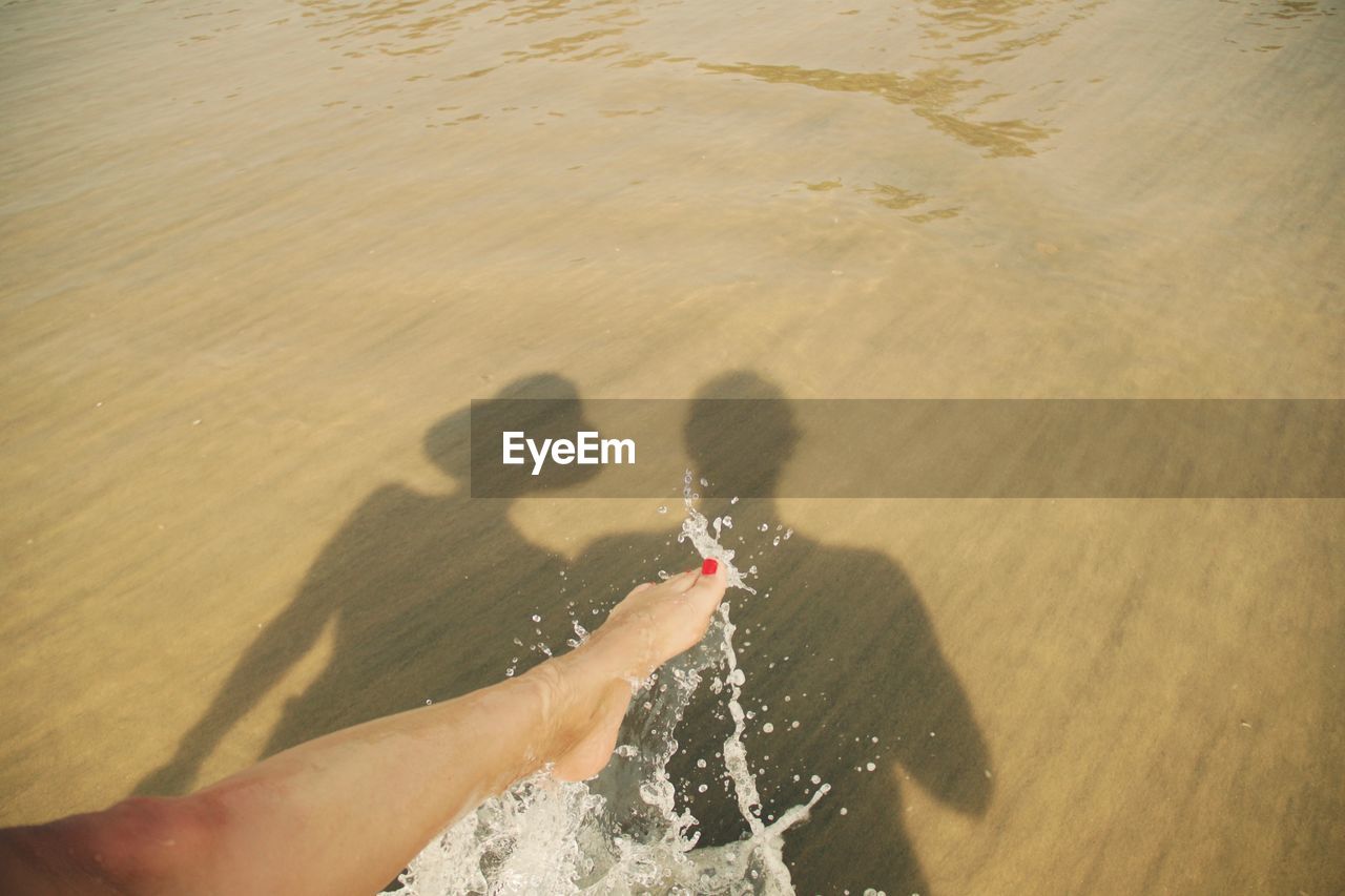 High angle view of shadows on beach