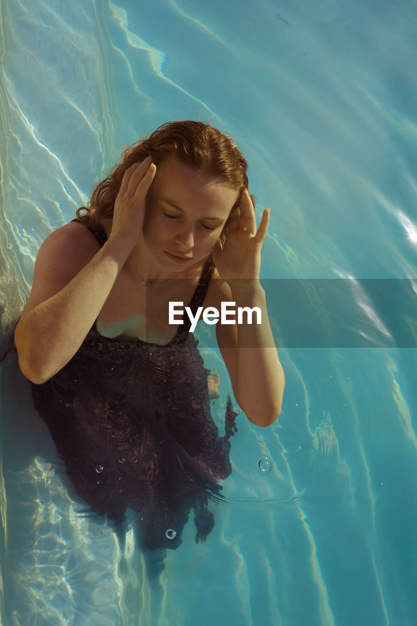 High angle view of woman in swimming pool