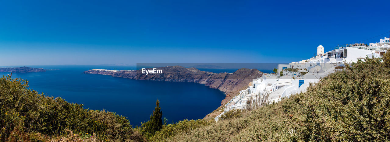 View of imerovigli village, the aegean sea and oia city from the walking trail  between fira and oia