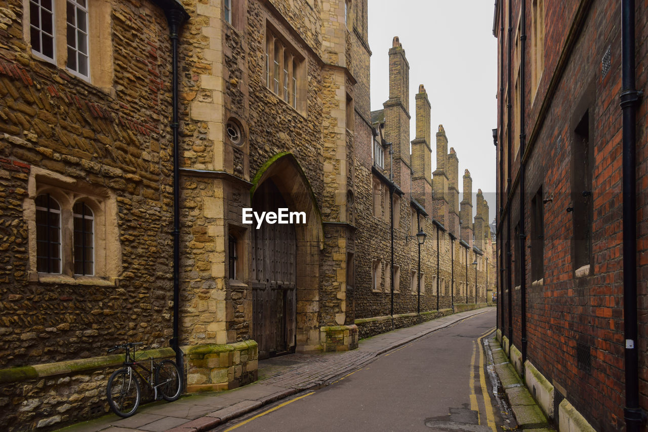 Alley amidst historic buildings in city