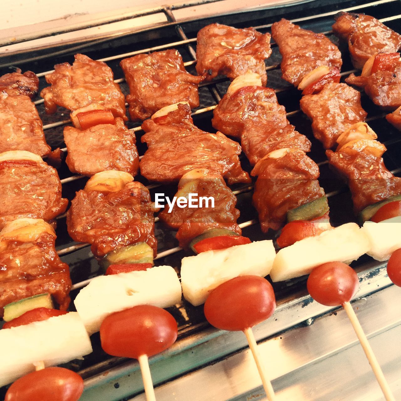 HIGH ANGLE VIEW OF VARIOUS VEGETABLES ON BARBECUE