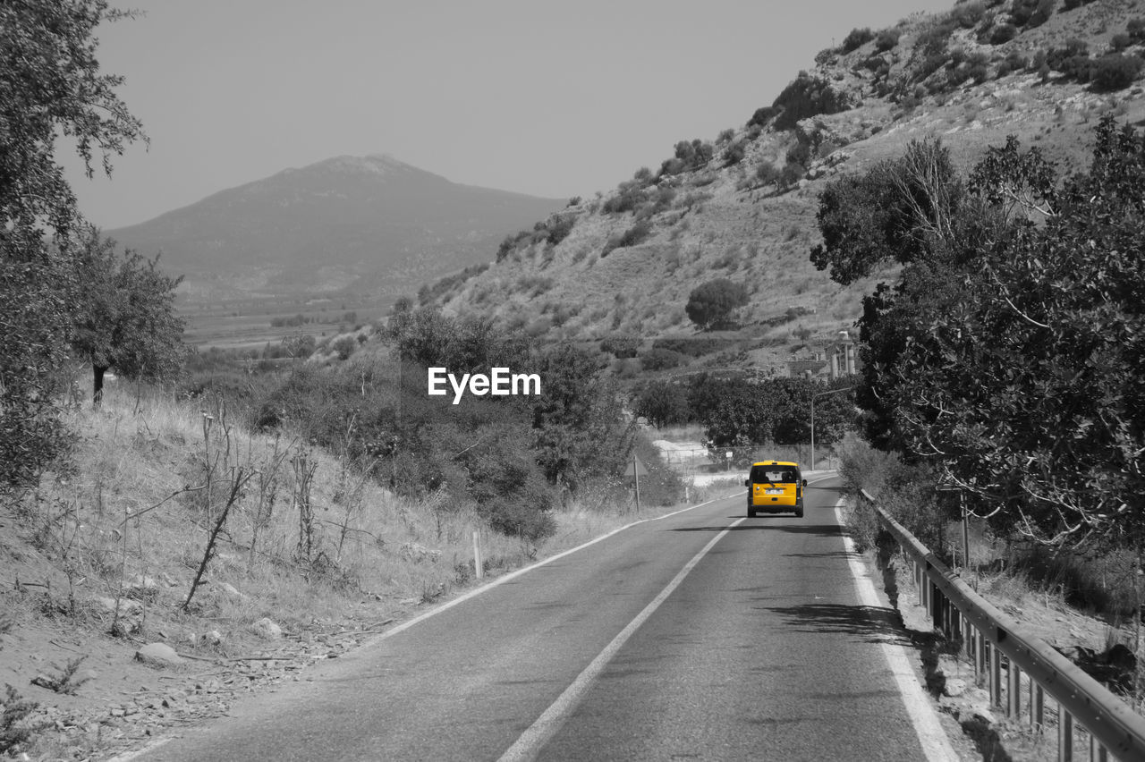 ROAD PASSING THROUGH MOUNTAINS