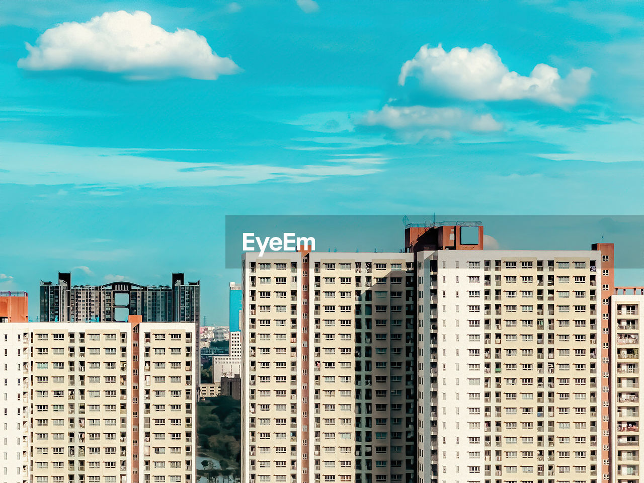 MODERN BUILDINGS AGAINST BLUE SKY