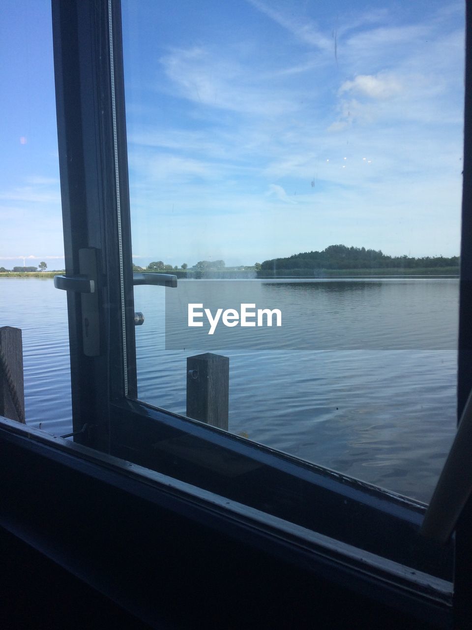 VIEW OF SEA SEEN THROUGH WINDOW