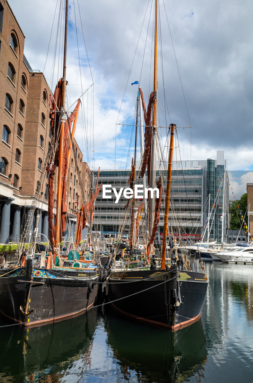 nautical vessel, water, transportation, mode of transportation, architecture, vehicle, sailboat, boat, sky, cloud, building exterior, city, harbor, nature, sailing ship, built structure, sea, travel, tall ship, mast, ship, travel destinations, pole, watercraft, moored, no people, sailing, outdoors, building, day, tourism, reflection