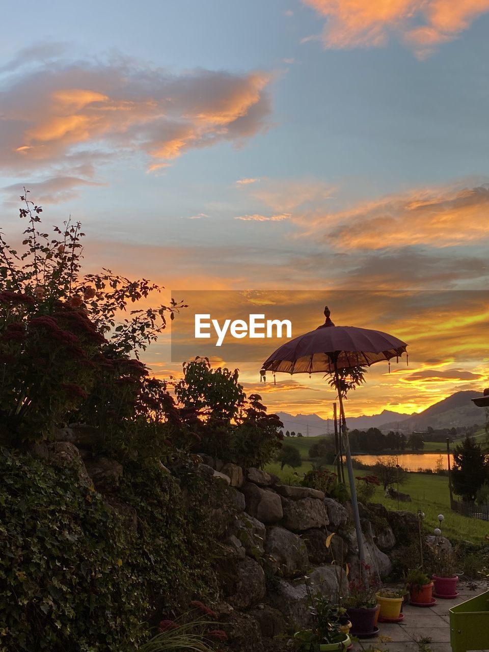 SCENIC VIEW OF ROCK AGAINST SKY DURING SUNSET