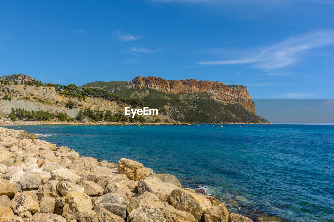 Scenic view of sea against blue sky