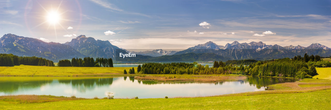 Scenic view of lake and mountains against sky in bavaria, germany