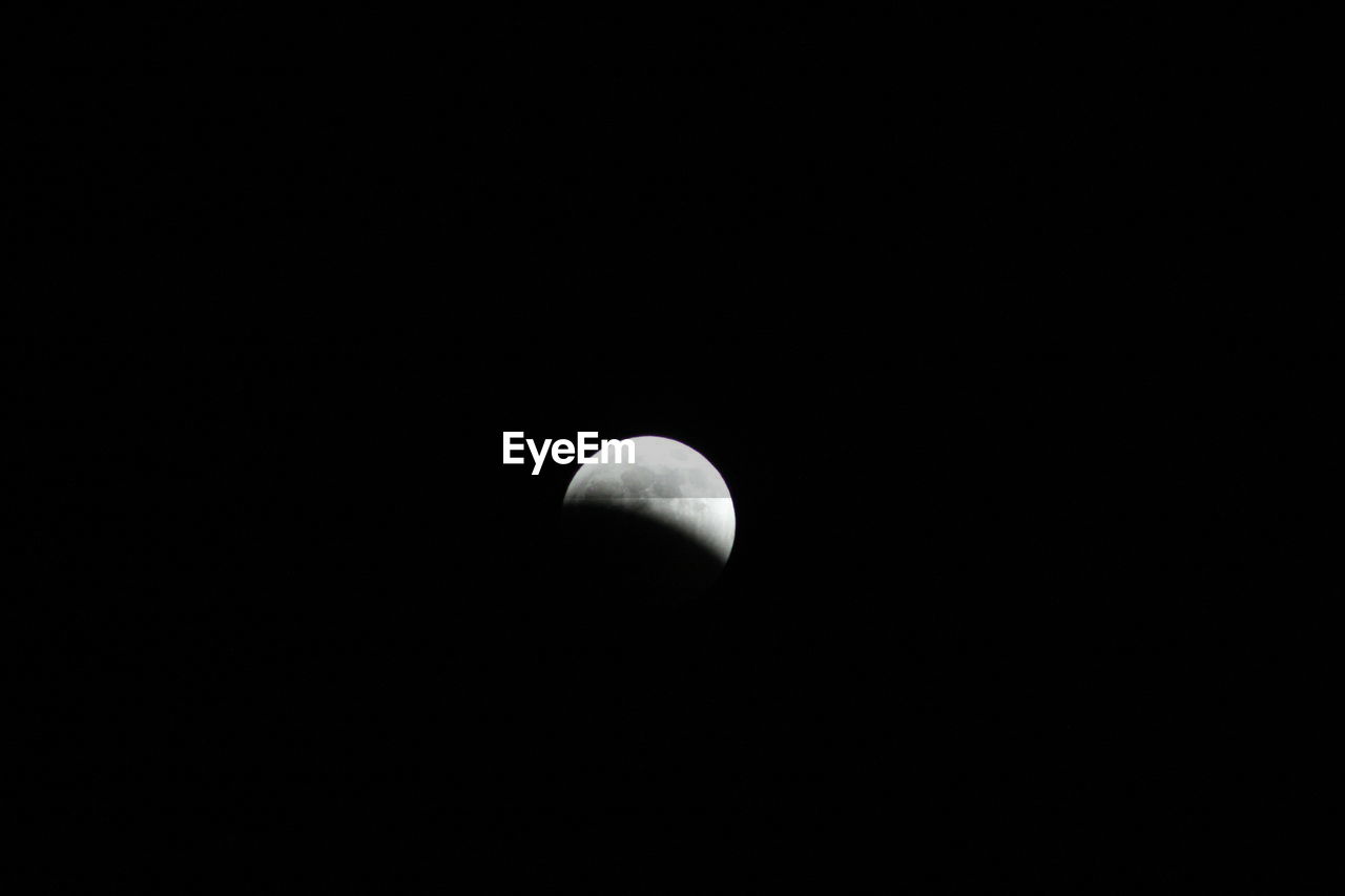 LOW ANGLE VIEW OF HALF MOON AGAINST SKY