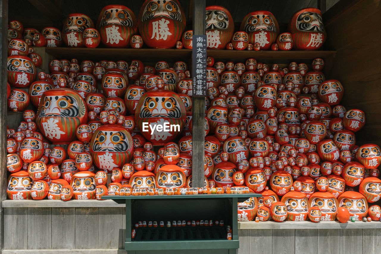 no people, architecture, tradition, large group of objects, religion, craft, temple - building, belief, history, travel destinations, spirituality, arrangement, the past, indoors, building, retail, shelf, abundance, built structure, travel