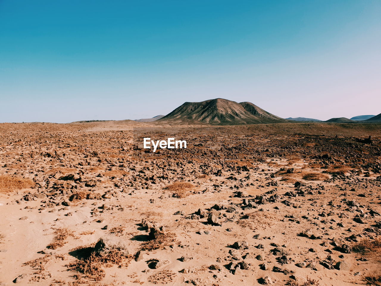SCENIC VIEW OF ARID LANDSCAPE AGAINST SKY