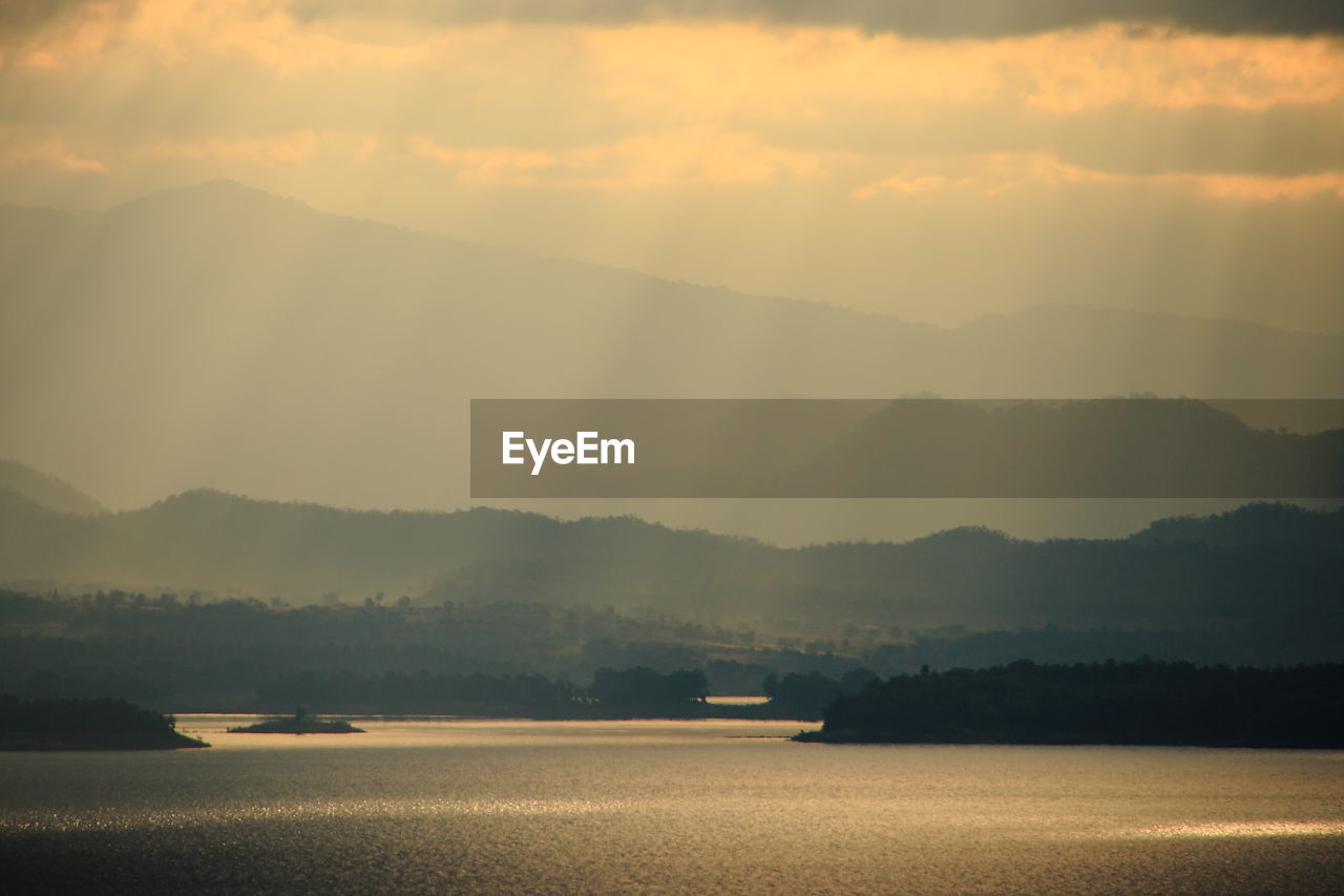 Scenic view of lake against sky during sunset