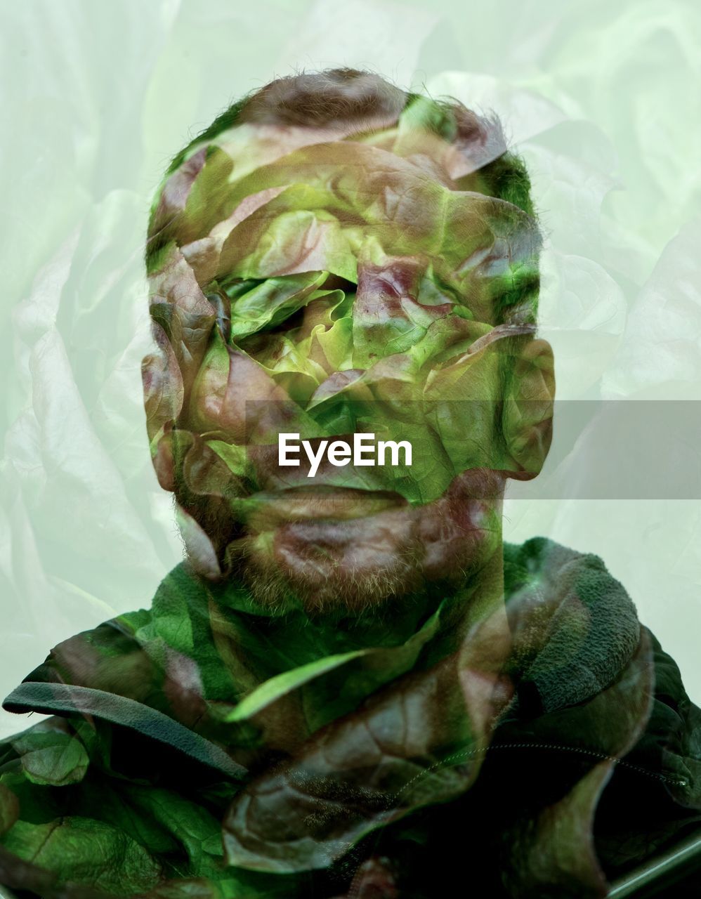 DOUBLE EXPOSURE IMAGE OF MAN WITH LEAF