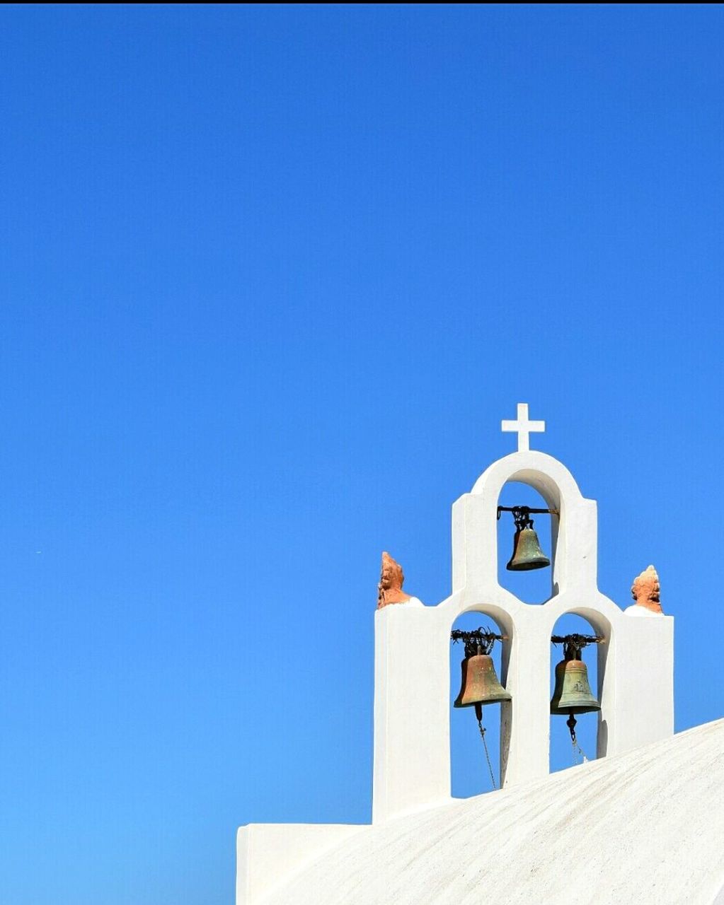 LOW ANGLE VIEW OF CHURCH AGAINST BLUE SKY