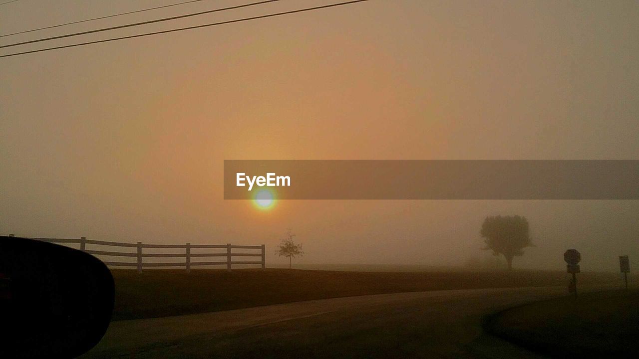 SCENIC VIEW OF LANDSCAPE AGAINST SKY AT SUNSET