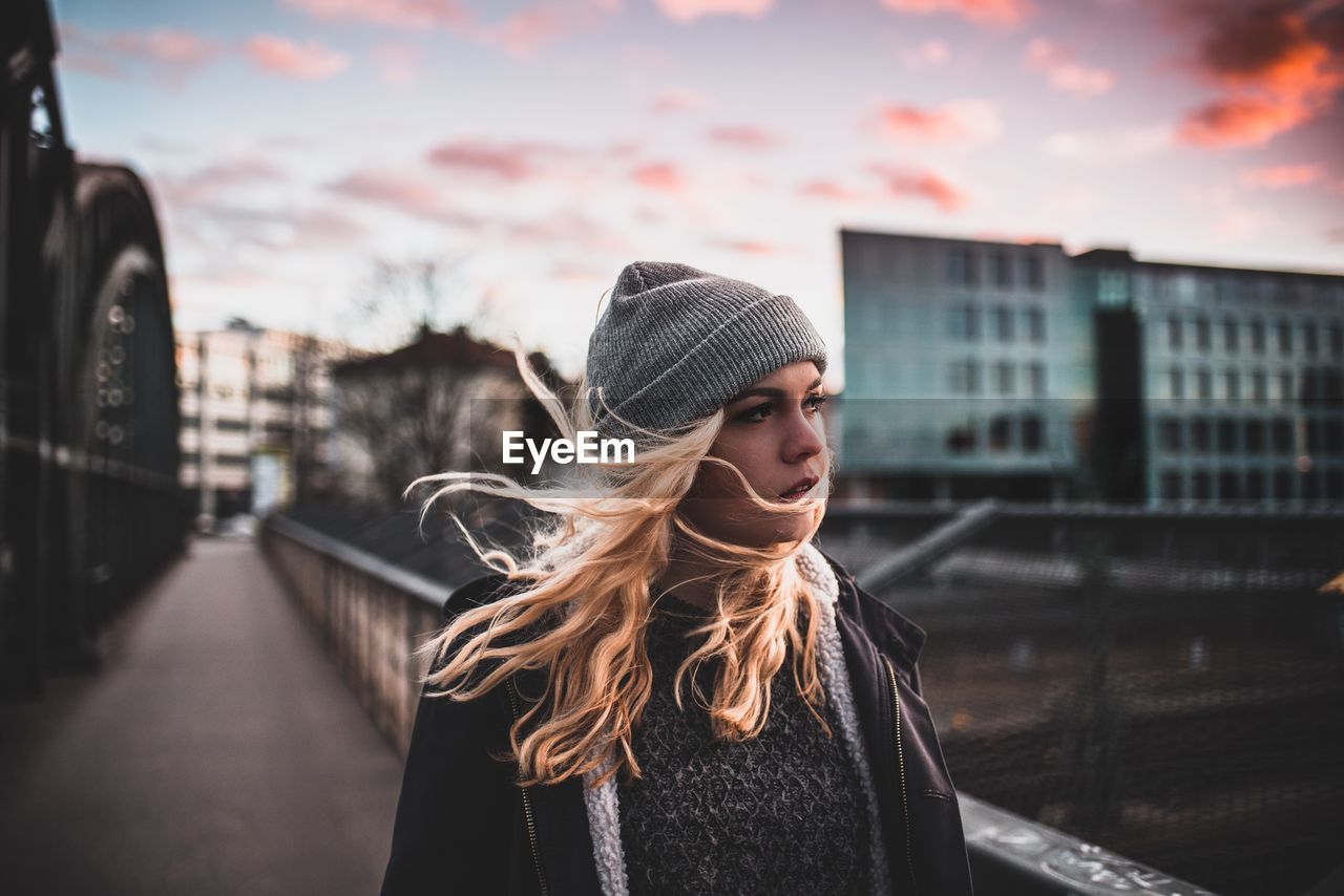 Close-up of woman standing against sky