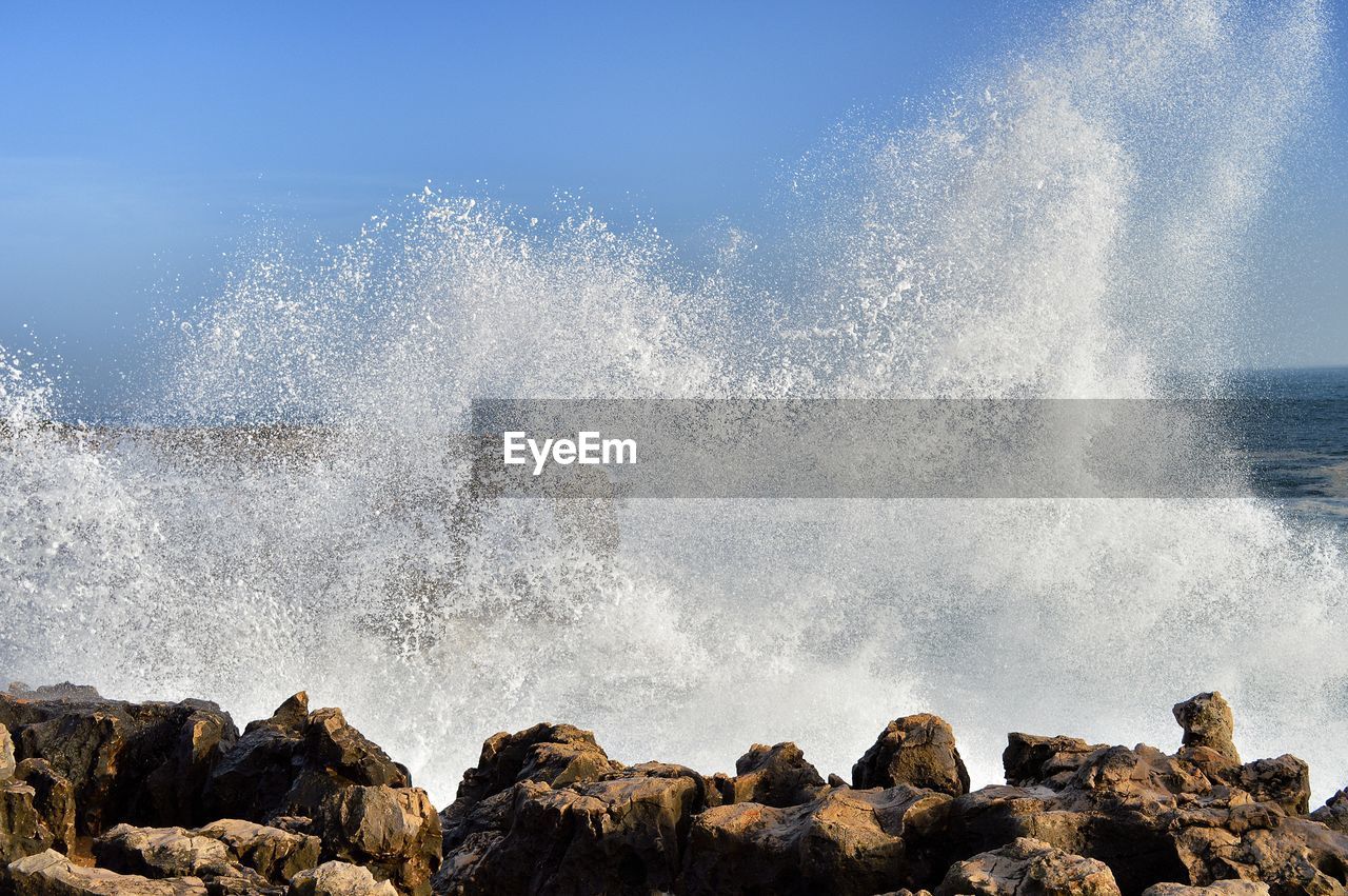 WATER SPLASHING ON ROCKS