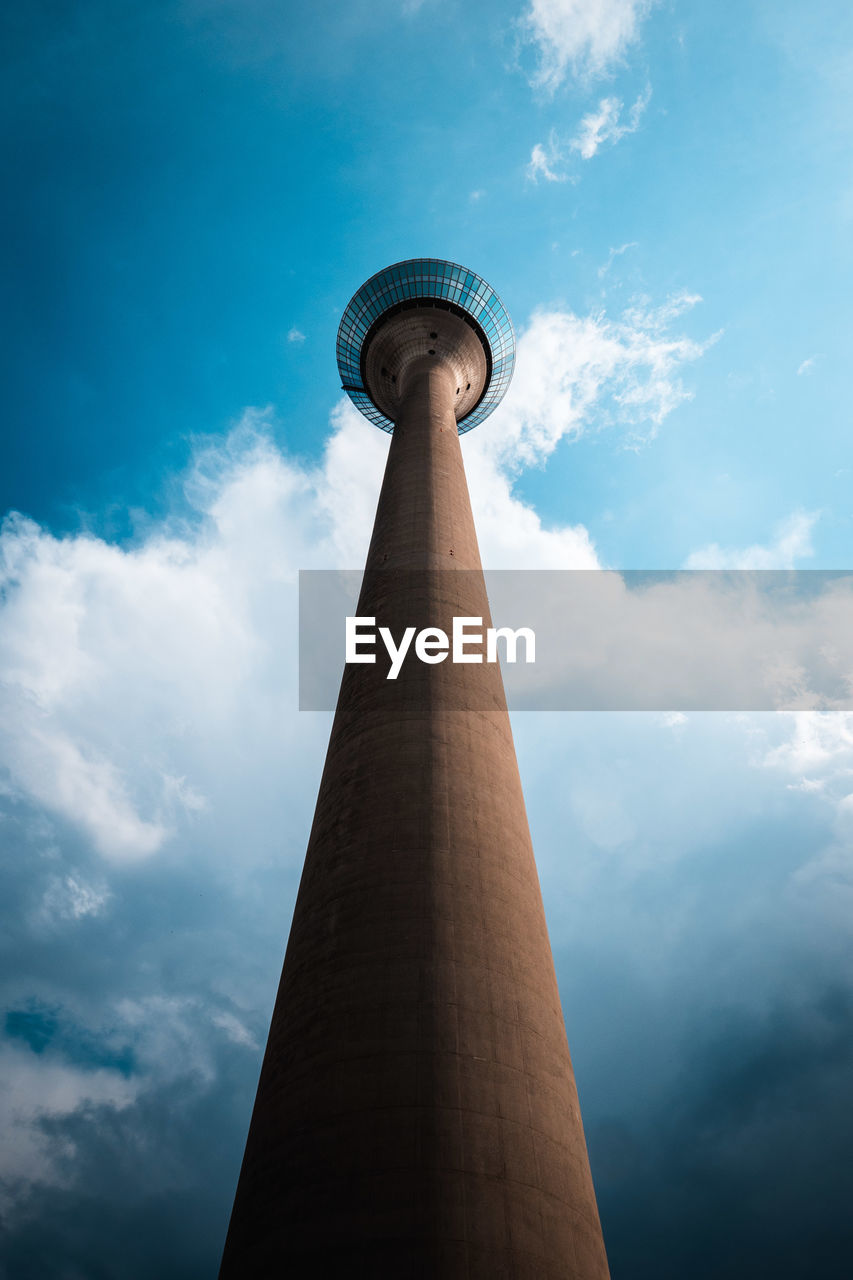 Low angle view of tower against cloudy sky