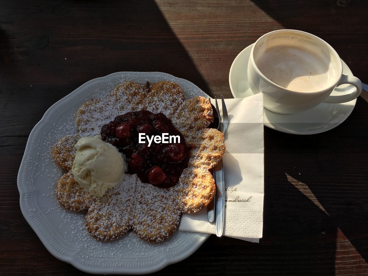 High angle view of waffle and ice cream served in plate with coffee