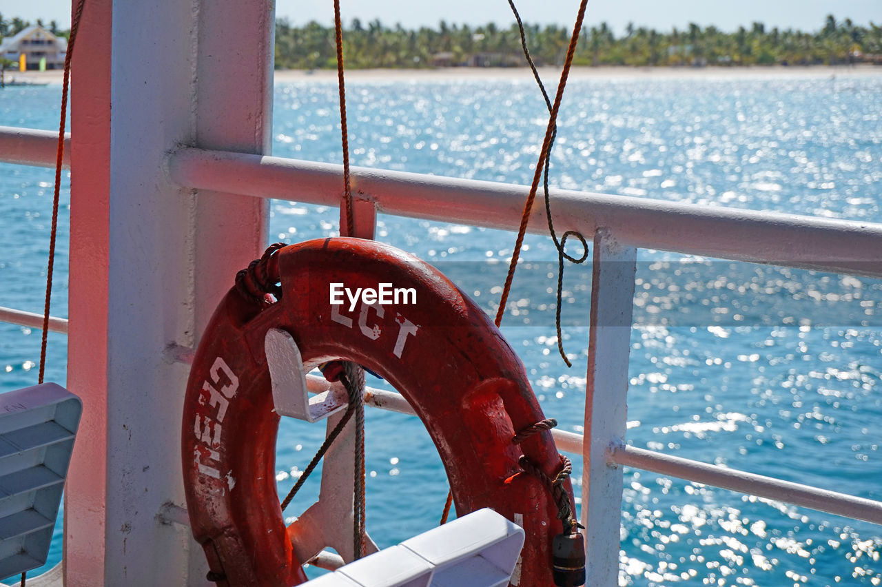 Close-up of life belt hanging on boat