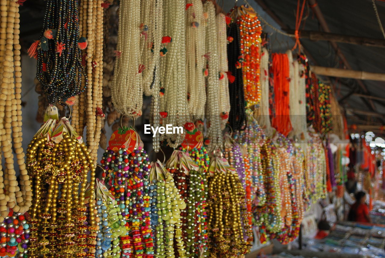CLOSE-UP OF DECORATIONS FOR SALE IN MARKET STALL