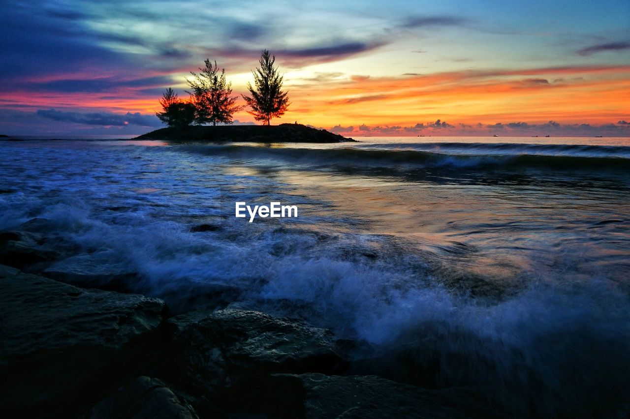 Scenic view of sea against sky during sunset