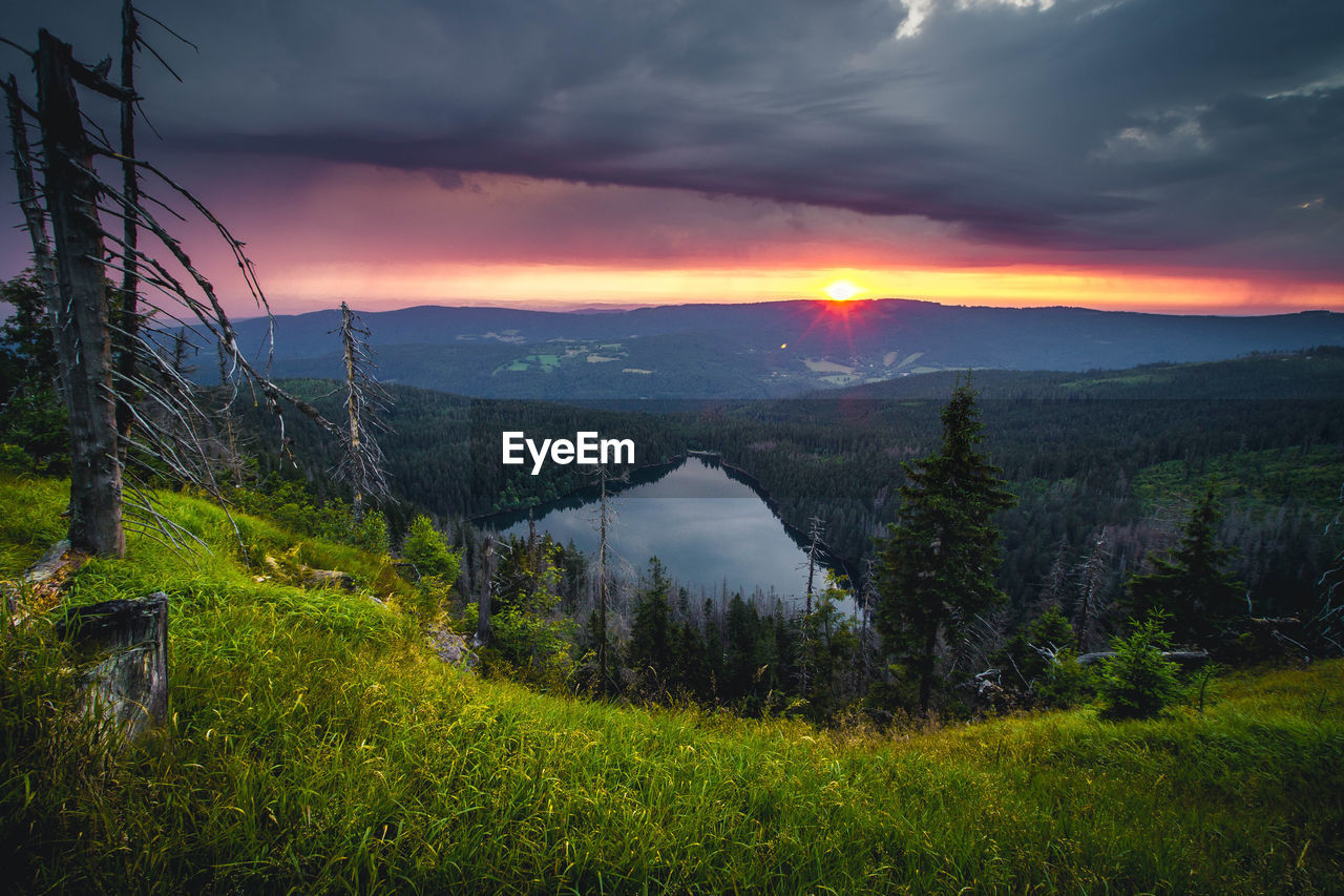 Scenic view of landscape against sky during sunset