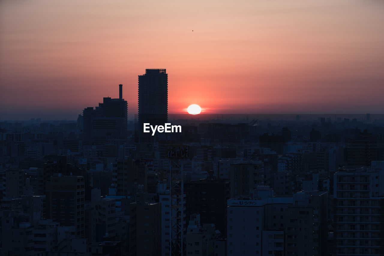 CITYSCAPE AGAINST SKY DURING SUNSET