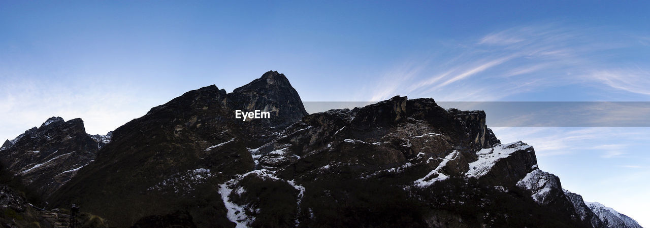 Panoramic shot of rocky mountains against sky