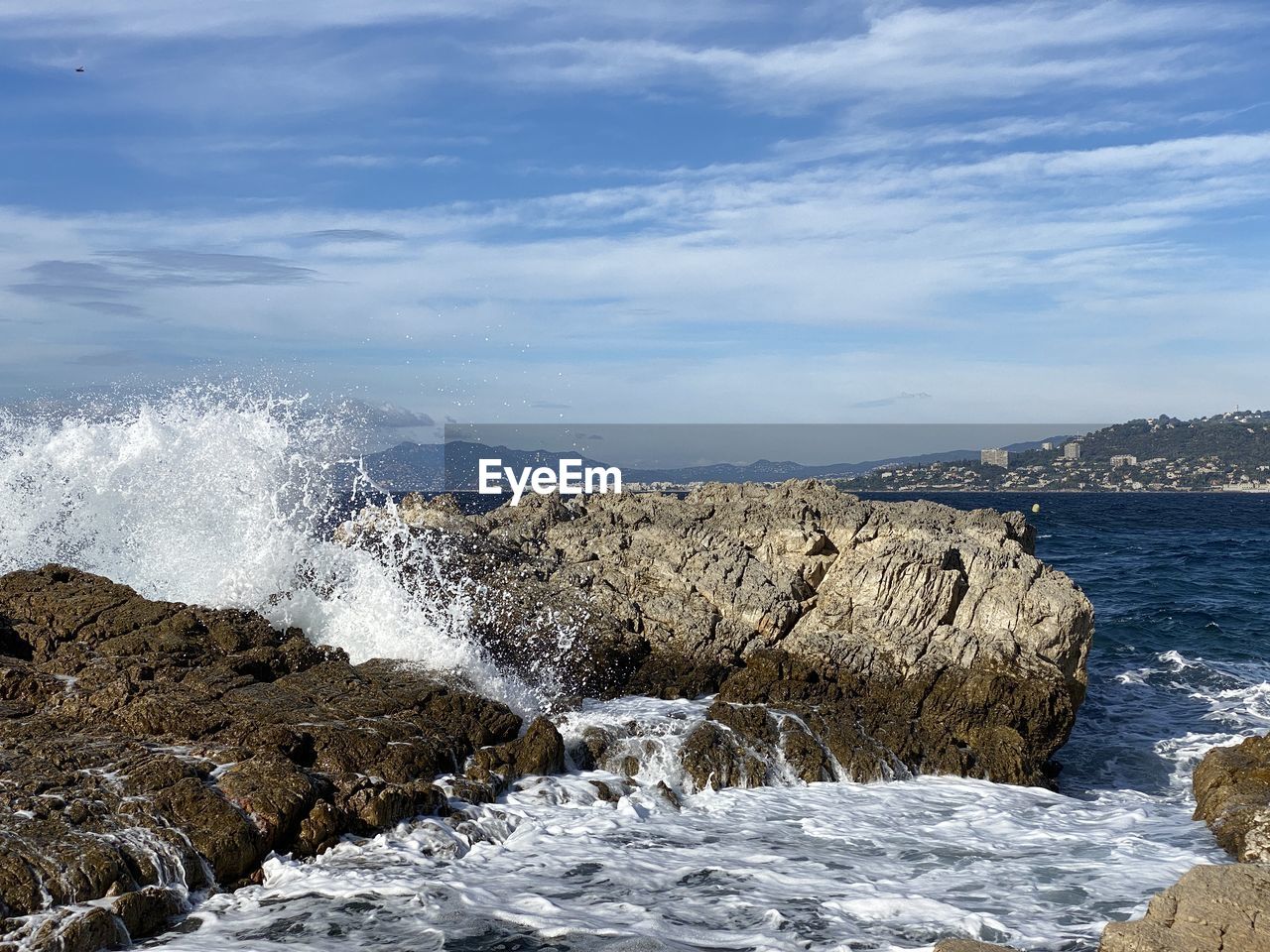water, sea, wave, ocean, shore, rock, coast, body of water, nature, beauty in nature, sky, scenics - nature, motion, land, beach, cloud, cliff, environment, wind wave, landscape, no people, winter, splashing, mountain, water sports, sports, outdoors, travel destinations, day, coastline, terrain, travel, rock formation, non-urban scene, blue