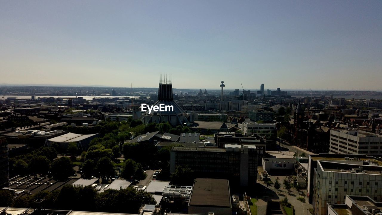 HIGH ANGLE VIEW OF BUILDINGS AGAINST SKY