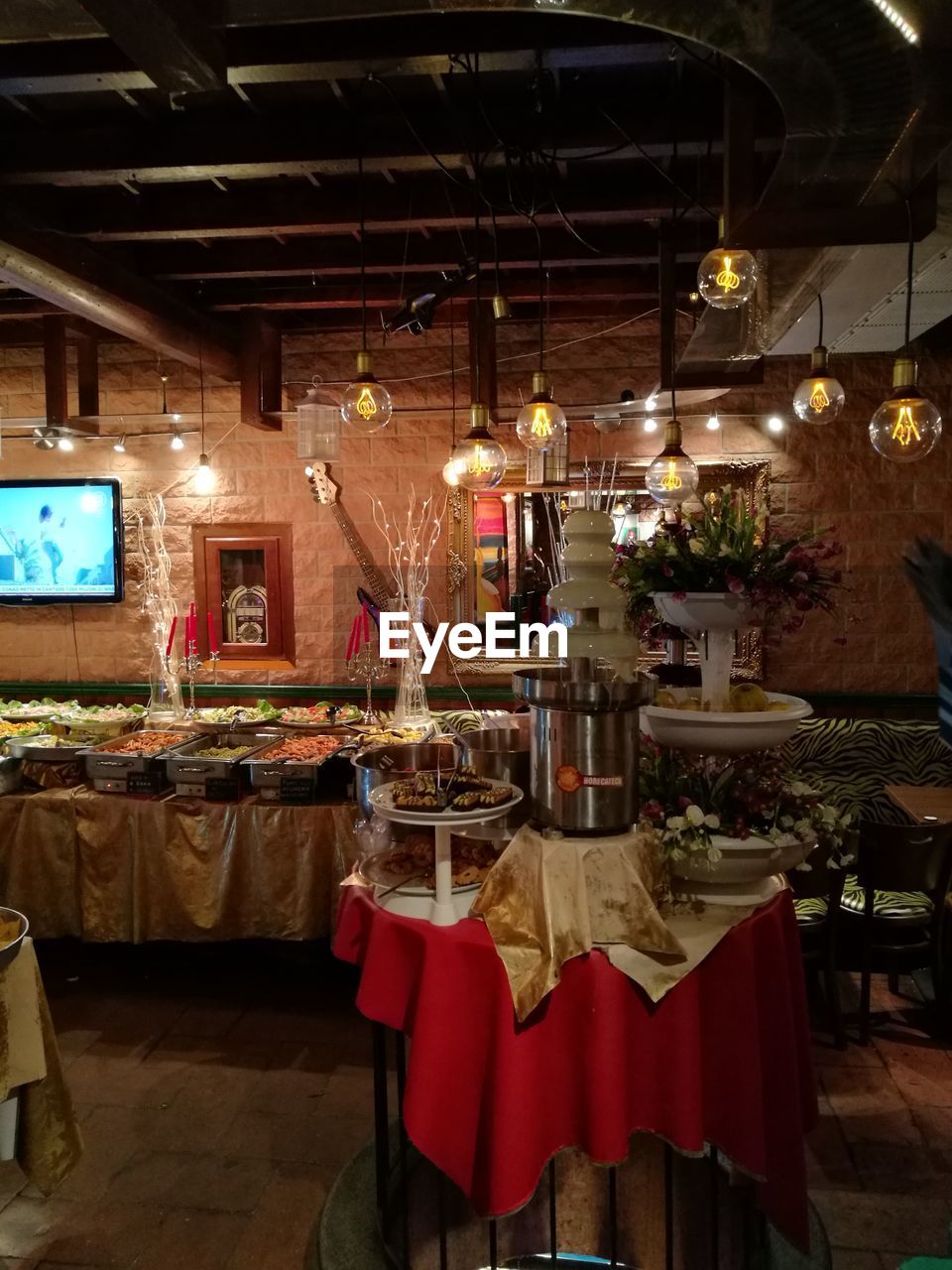 INTERIOR OF ILLUMINATED RESTAURANT