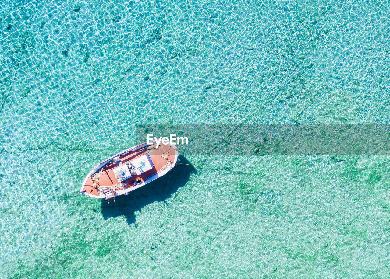 High angle view of boat floating on sea
