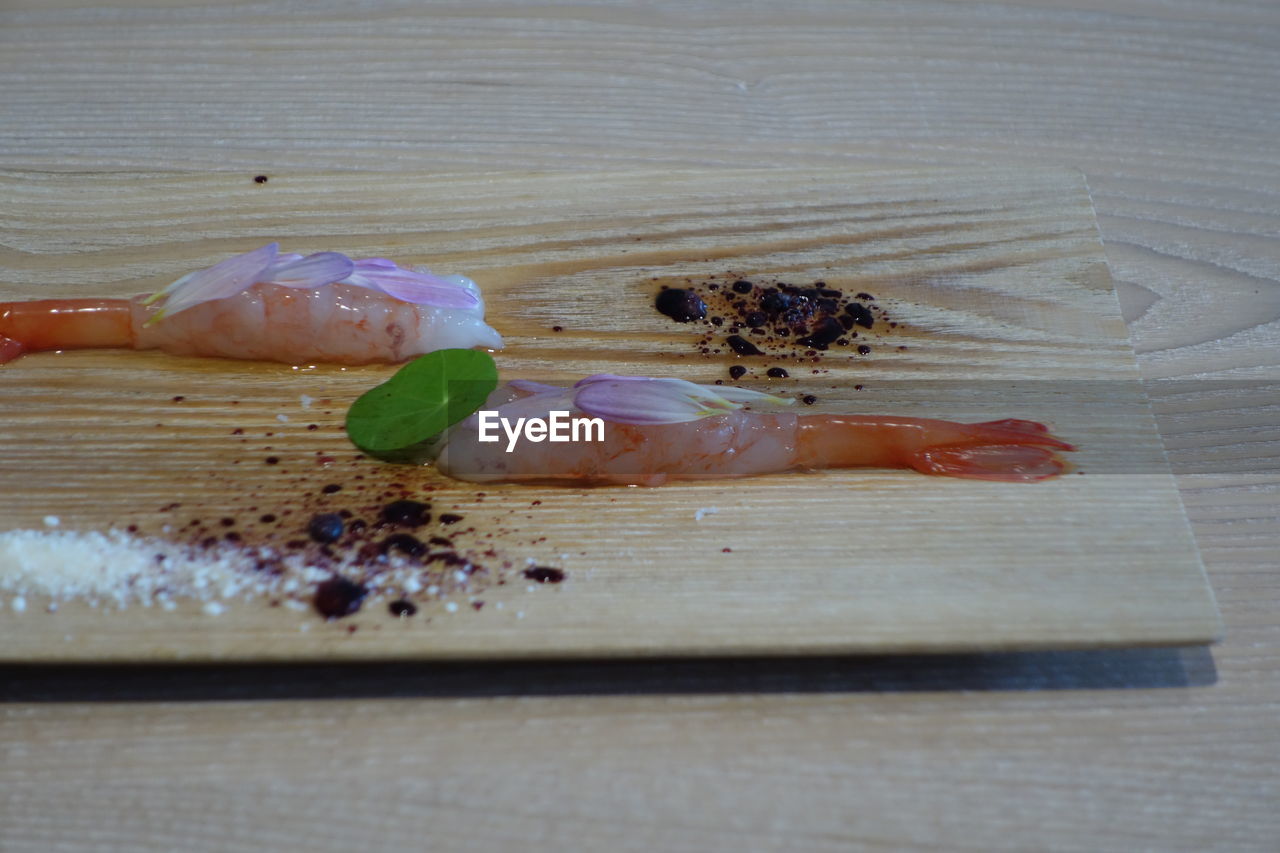 Close-up surface level of prawns on chopping board