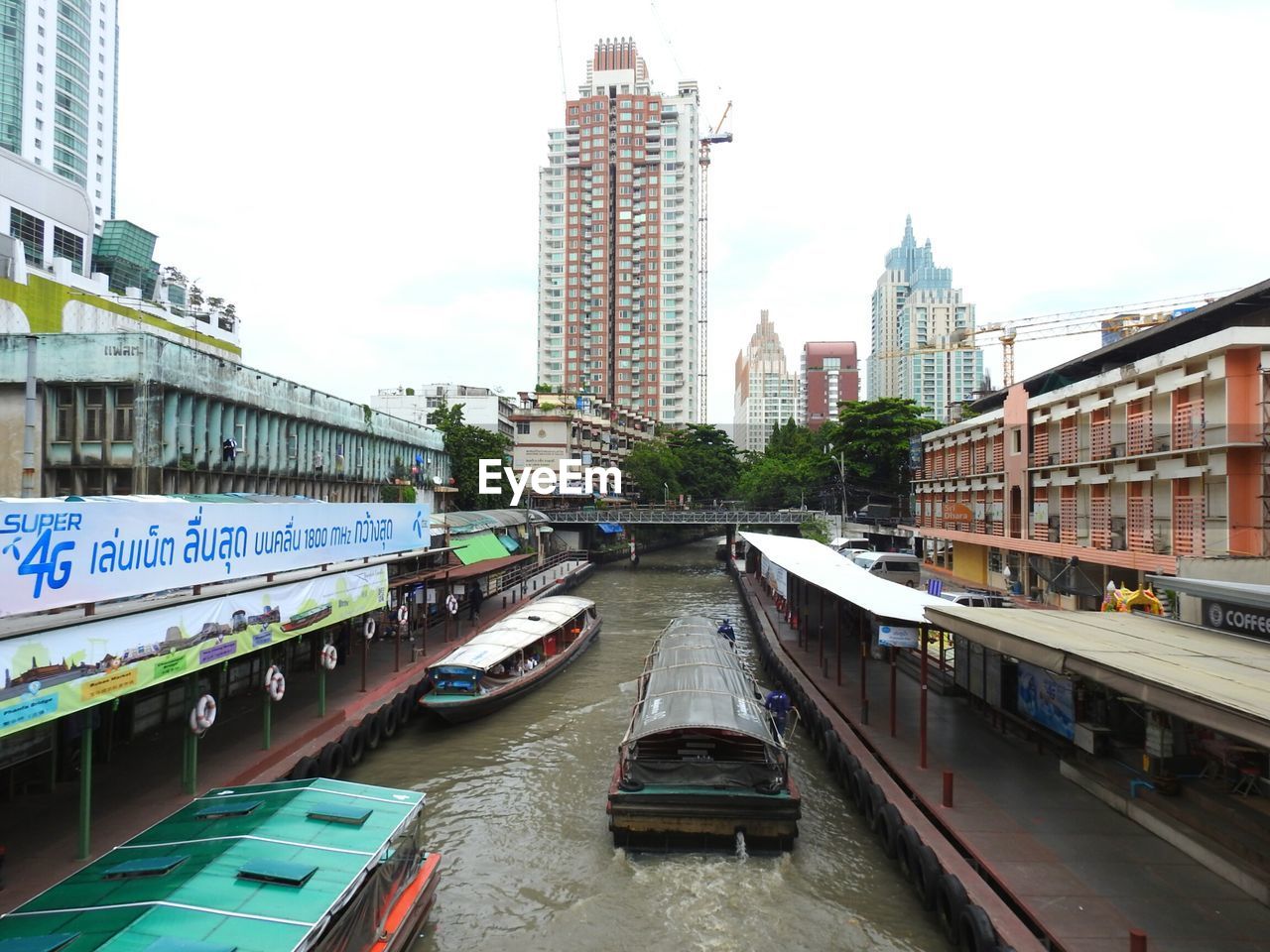 CARS MOVING ON BRIDGE OVER RIVER