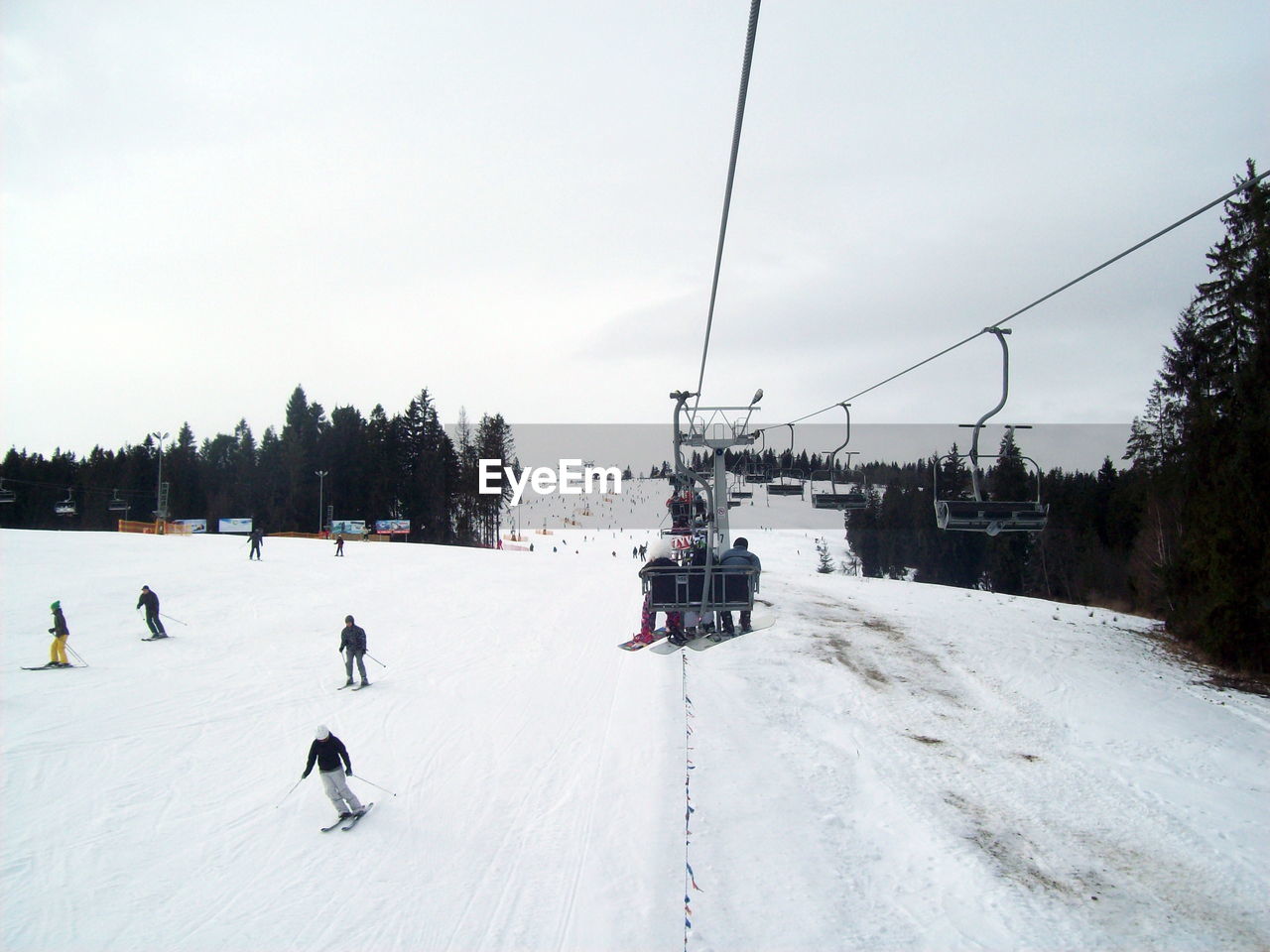 People skiing on snowcapped mountain