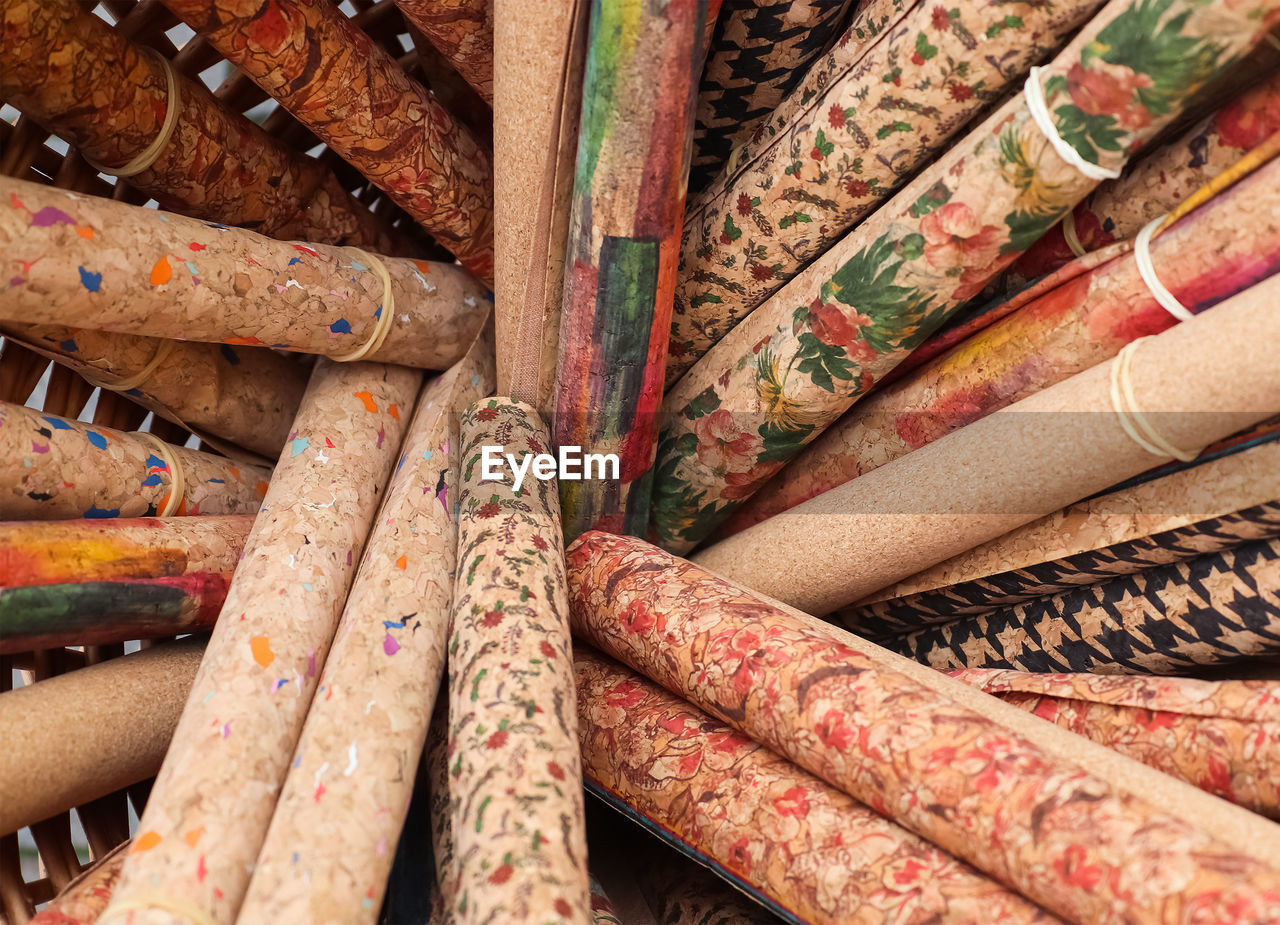 Samples of cloth and fabrics in different colors found at a fabrics market.