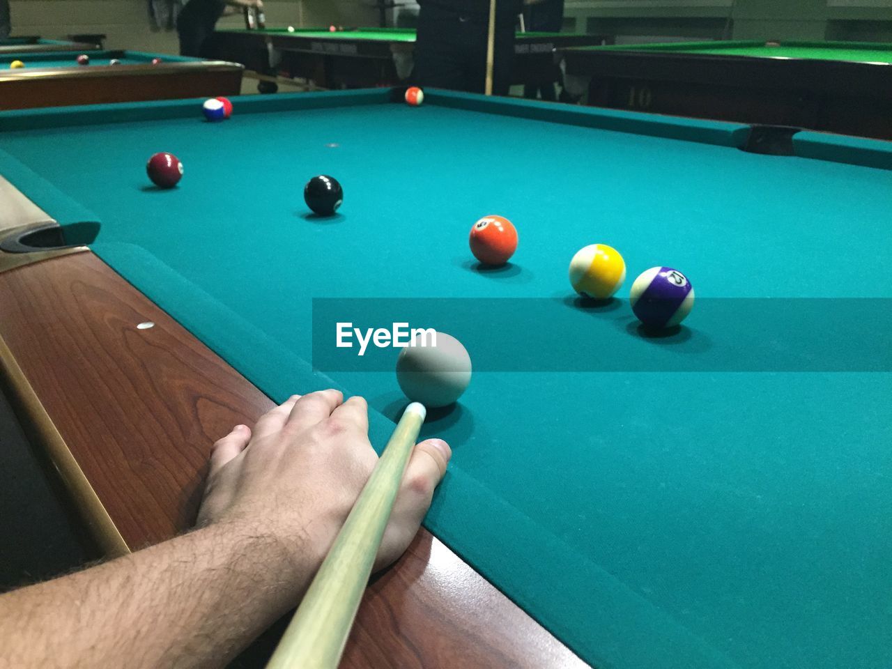 Cropped image of man playing pool