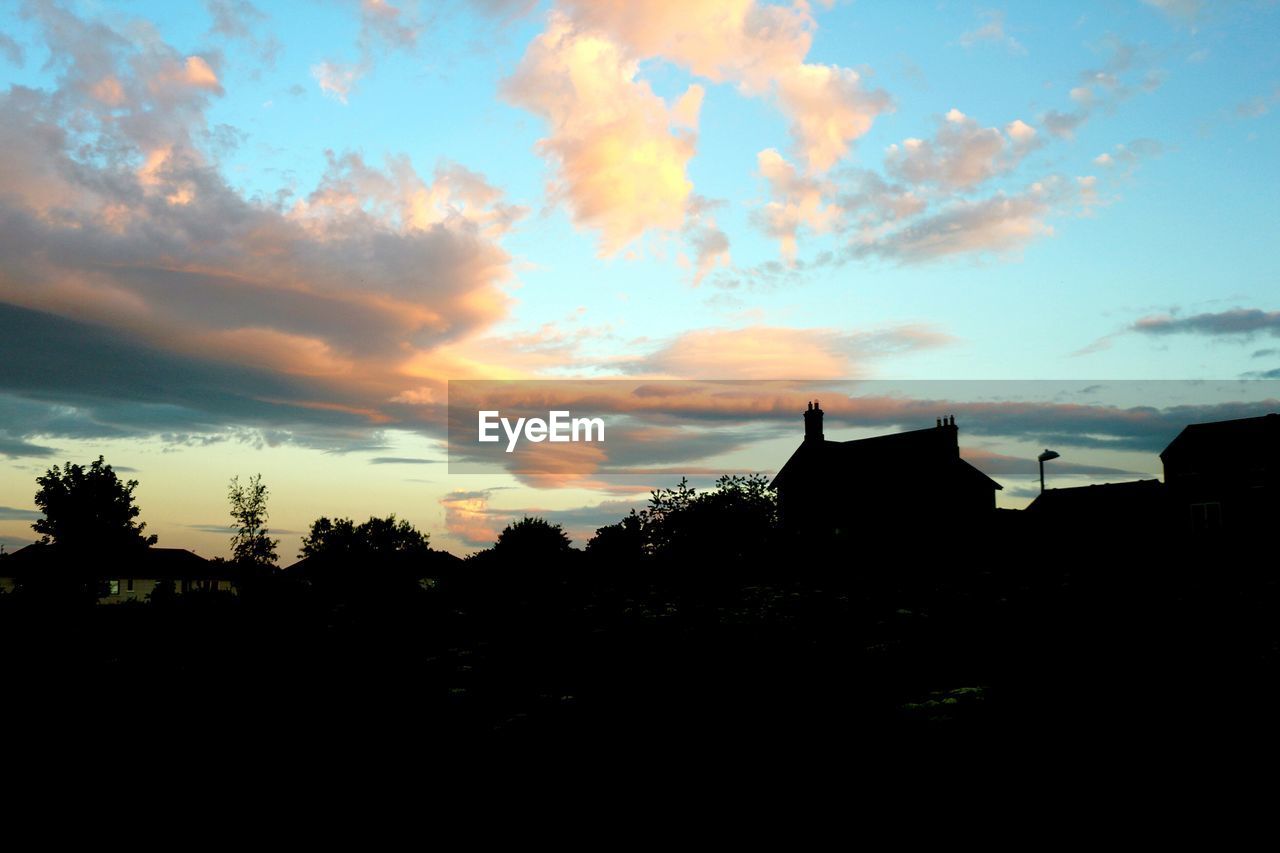 SILHOUETTE OF BUILDING AT SUNSET