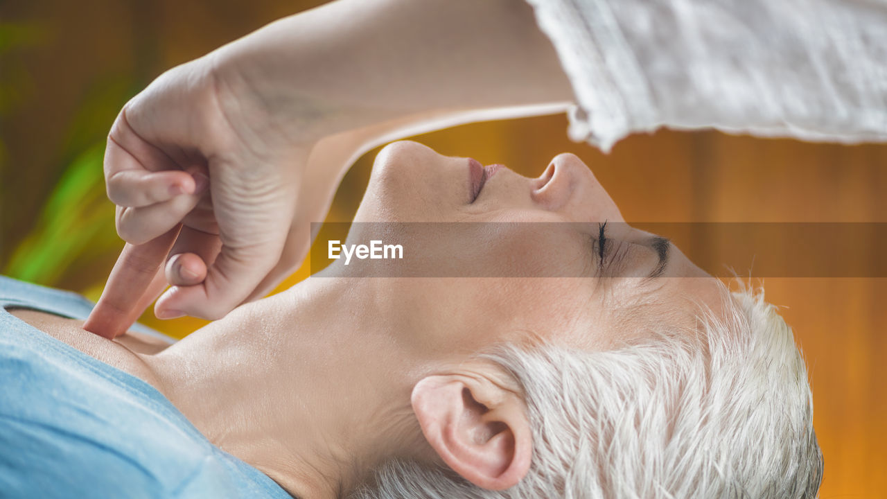 Close-up of woman getting massage at spa