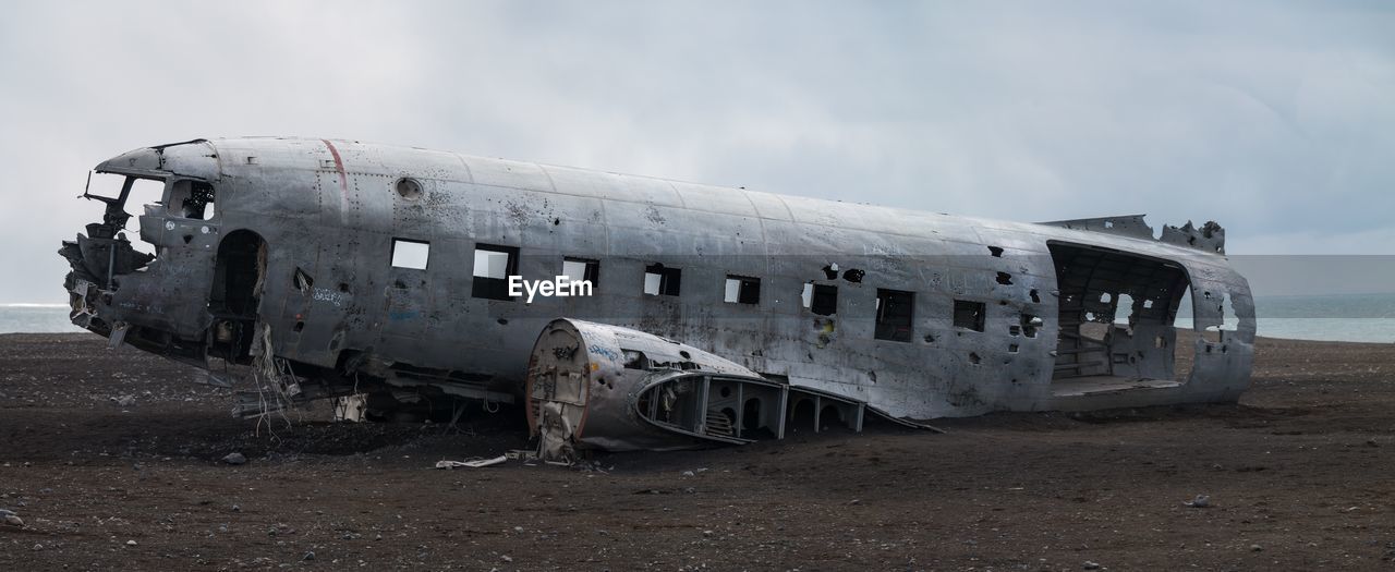 Abandoned airplane in iceland on a beach